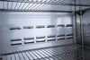 Interior shelves of a commercial refrigerator with solid doors showcasing its spacious design and durability.