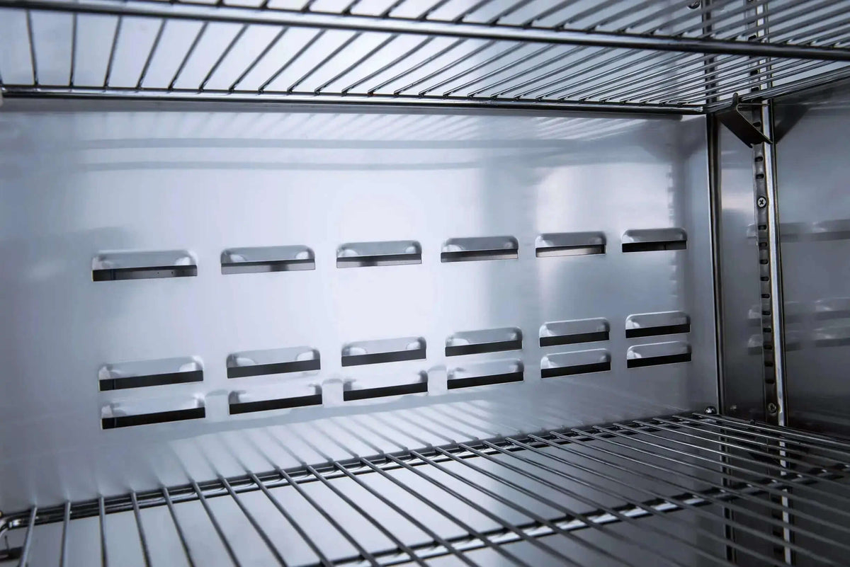 Interior shelves of a commercial refrigerator with solid doors showcasing its spacious design and durability.